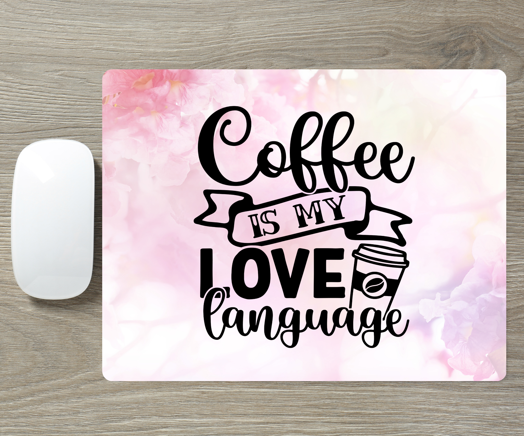 Mouse pad with 'Coffee is my love language' text on a watercolor background