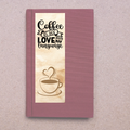 Notebook with 'Coffee is my love language' design on a textured surface