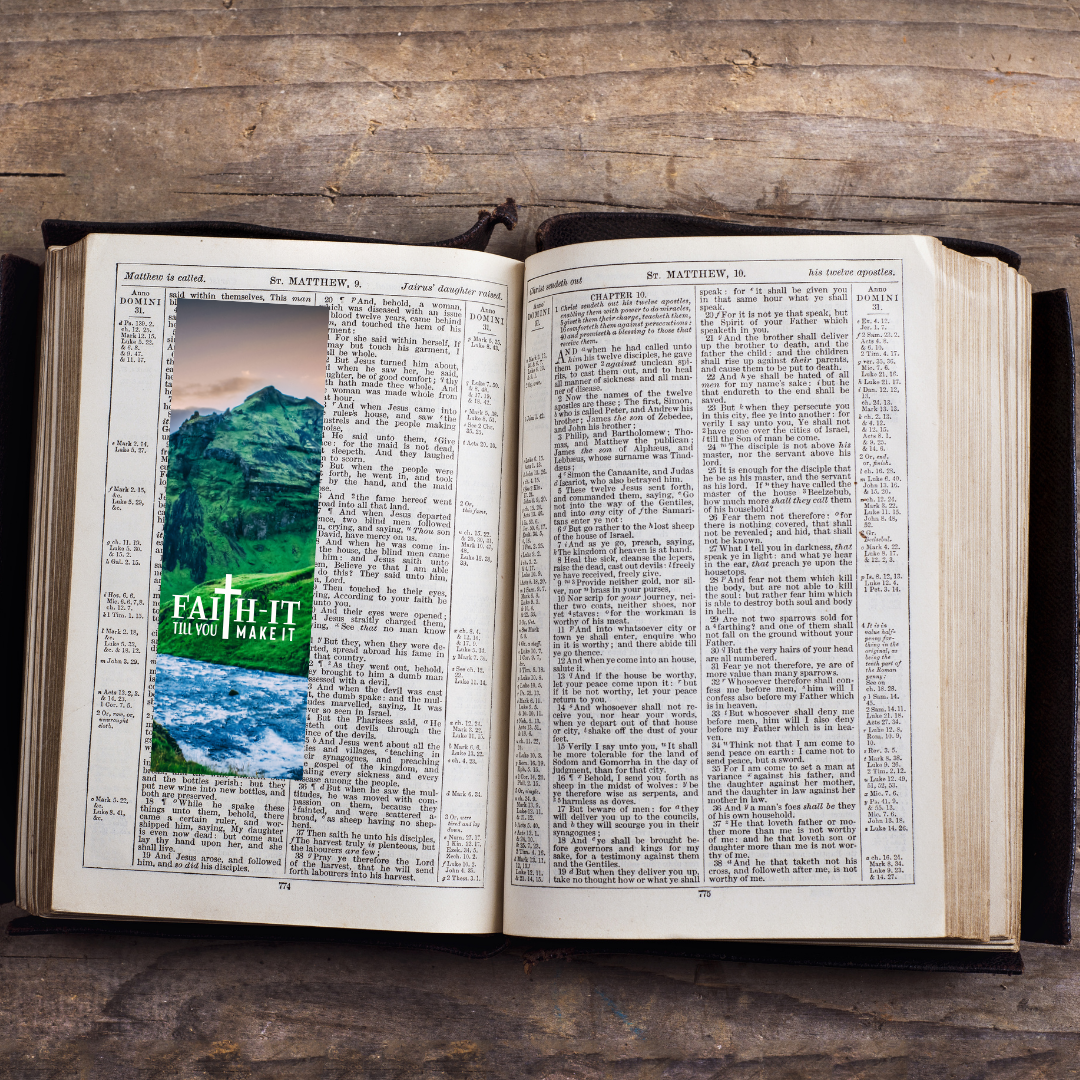 Open book with scenic images and 'Faith It' text on a wooden surface