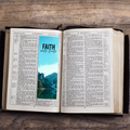 Open book with a blue bookmark featuring 'Faith over Fear' on a wooden surface