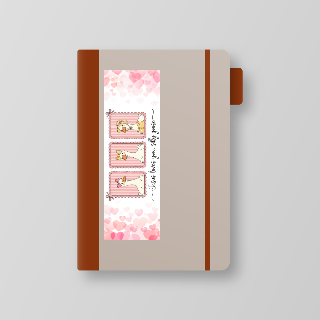 Notebook with a decorative cover featuring illustrations and text on a light gray background