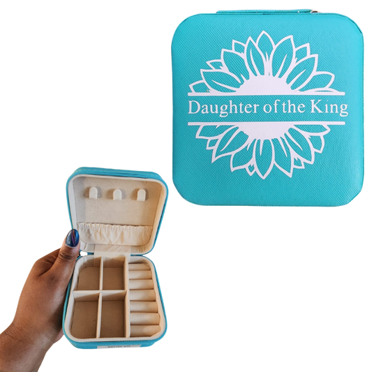 Turquoise jewelry case with 'Daughter of the King' design on a white background