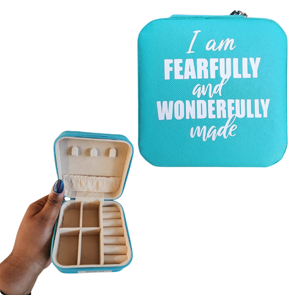Turquoise jewelry case with 'I am Fearfully and Wonderfully Made' text, held open to show interior.