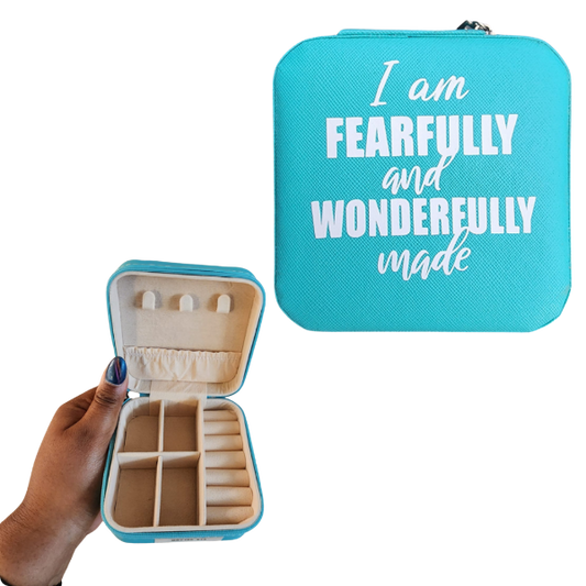 Turquoise jewelry case with 'I am Fearfully and Wonderfully Made' text, held open to show interior.